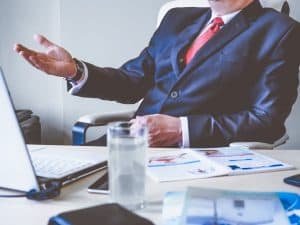 Why do companies participate in international business transactions?