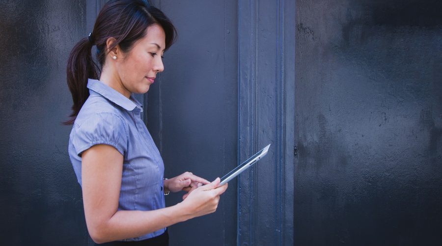 Woman reading on tablet