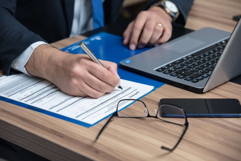 Business man signing documents