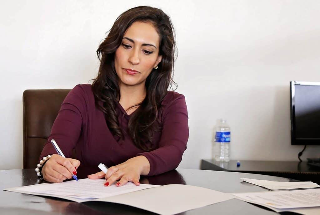 Woman signing documents