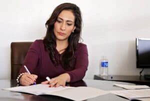 Woman signing documents