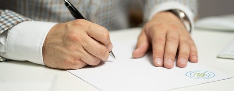 Man signing document