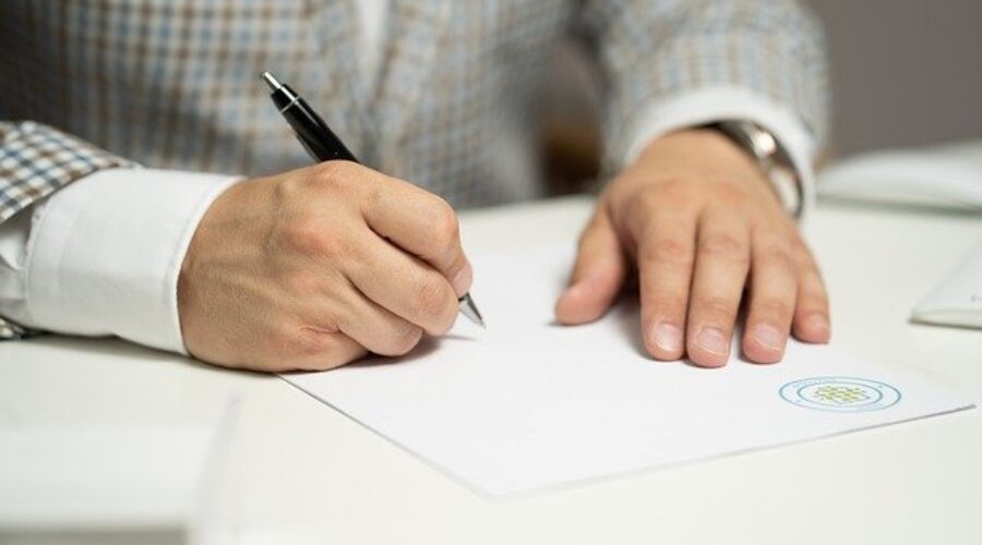 Man signing document